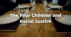 blurry image of a table with the words The Four Children and Racial Justice