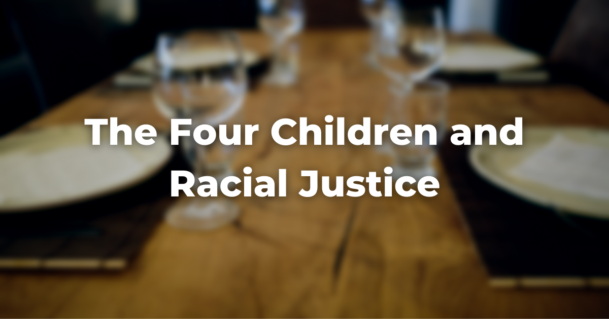 blurry image of a table with the words The Four Children and Racial Justice