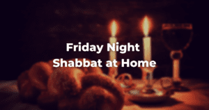 Blurry image of candlesticks, challah, and a kiddush cup with the words: Friday Night Shabbat at Home